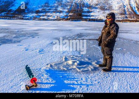 Preparing fiskesuppe over a campfire
