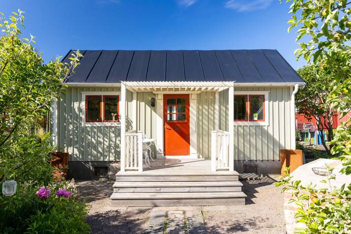 A home with a well-kept lawn and garden