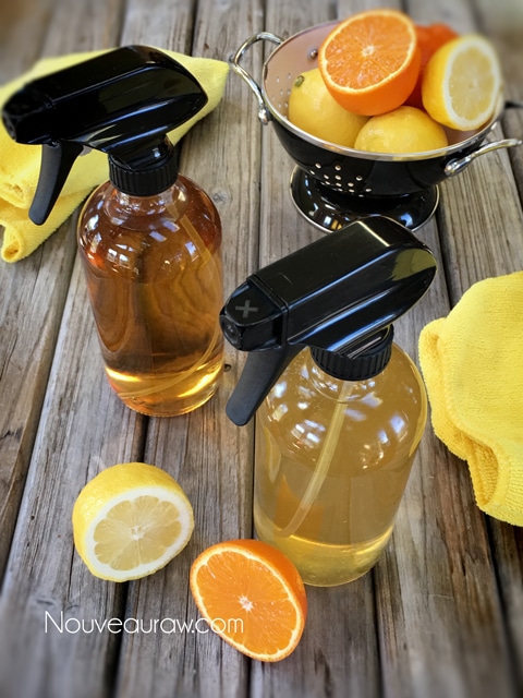Glass jars filled homemade cleaners ingredients