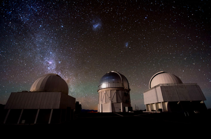 Image depicting someone setting up astrophotography equipment in the Atacama Desert near Awasi Atacama, showcasing the resort's compatibility with astronomical pursuits and dark sky preservation.