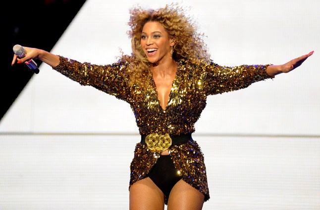 Press photo of Beyoncé during a press conference, answering questions about the Super Bowl XLVII performance.
