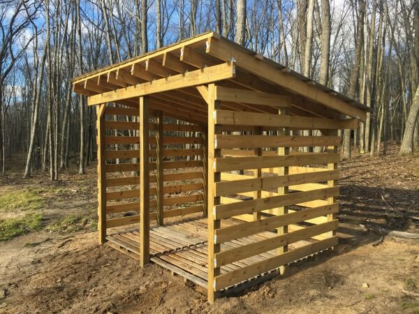 All materials and tools for the wood shed project neatly arranged