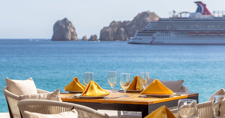 Maya and Daniel hiking on a trail with ocean views