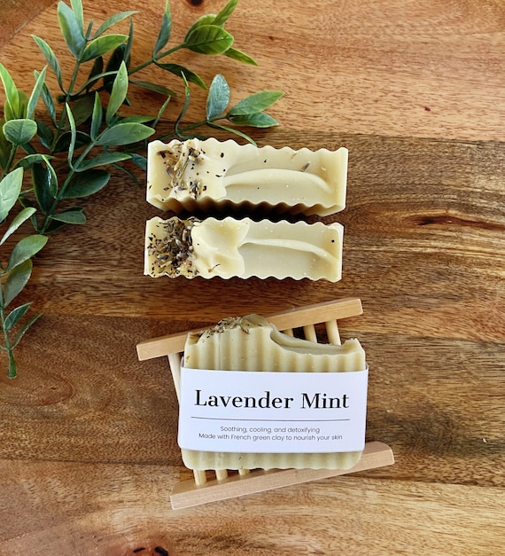 Close-up of hands crafting a soap bar, showcasing the artisan's touch and natural ingredients