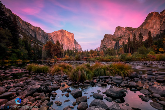 David and Michael stand hand-in-hand, silhouetted against the sunset at Tunnel View, Yosemite National Park.