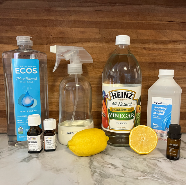 A variety of fresh citrus fruits, including lemons, limes, and oranges, arranged in a bowl.