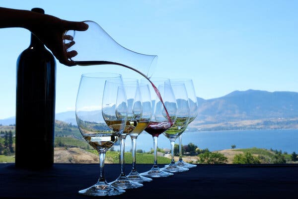 The dramatic coastline of Fogo Island, with the Inn perched on the rocks, taken during golden hour. This highlights the inn's isolated yet stunning location and the vastness of the island with the drone shot. The warm light adds an inviting atmosphere.