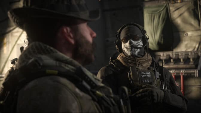 A gamer intensely focused on playing Call of Duty: Modern Warfare III on a laptop with integrated graphics via NVIDIA GeForce Now, showcasing excitement and immersion despite modest hardware.