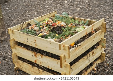 Outdoor compost bin layer leaves scraps
