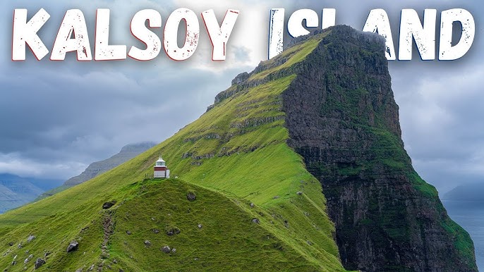 A wide-angle shot of Kallur Lighthouse perched on a cliff edge, capturing the vastness of the Faroese landscape and the solitary nature of the lighthouse against the dramatic horizon.