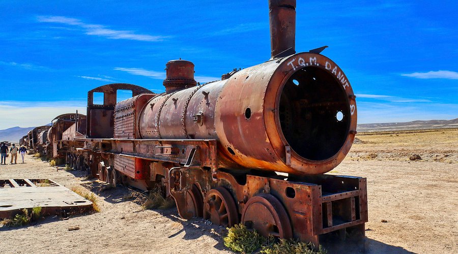 Laguna Colorada showcases vibrant red waters filled with pink flamingos, illustrating the unique beauty of the mineral lakes.
