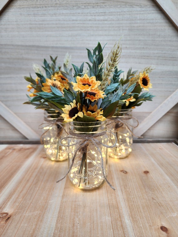 Close-up shot detailing the textures of the burlap, mason jars, and other decorative elements.