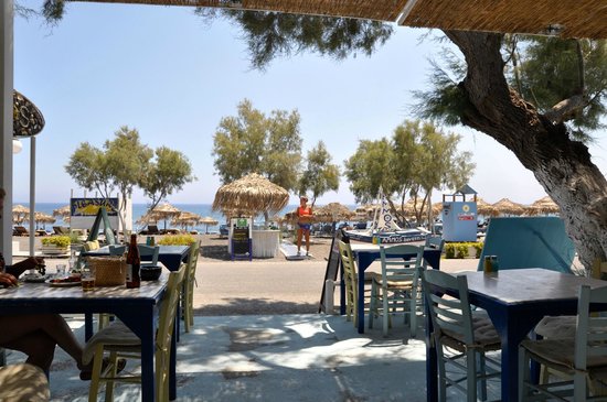 Winding streets of Oia, Santorini, with blue-domed churches