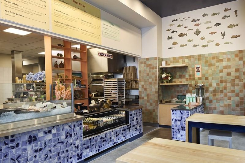 An interior scene of a restaurant NOPA fish s interior is full of details by local artisans.
