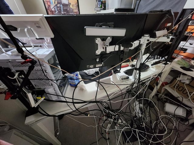 A complete gaming setup with a monitor, keyboard, mouse, and the assembled PC.