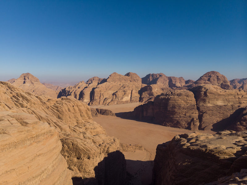 Climbers using traditional climbing techniques in Wadi Rum