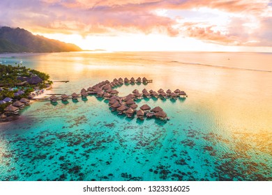 Luxury travel vacation aerial overwater bungalow in Bora Bora