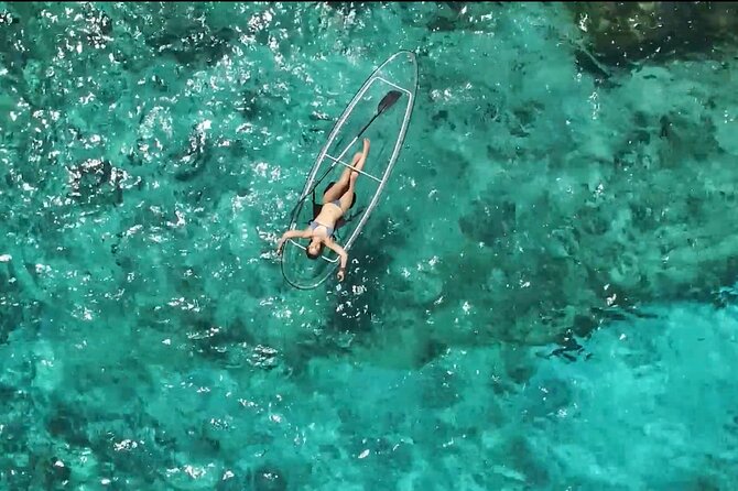 Mateo, silhouetted against the night sky, intently adjusting his Sky-Watcher telescope, capturing the dedication required for astrophotography, with the Milky Way faintly visible.