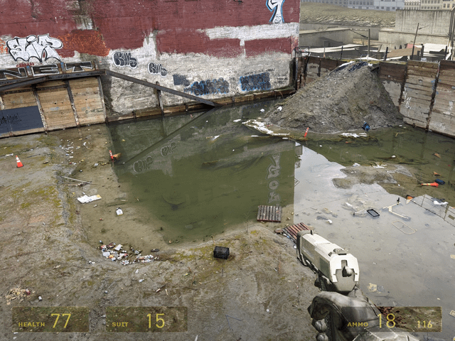 A dynamic in-game screenshot of the Gravity Gun in action, lifting a metal object with visible energy particles swirling around it.
