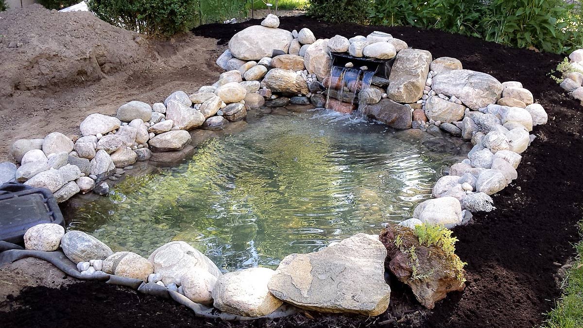 measuring tape planning pond backyard
