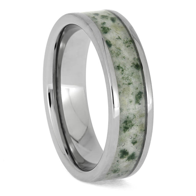 Two people are smiling, holding trash bags full of plastic and debris; the alt text accurately describe what the people are doing and how they may feel about it