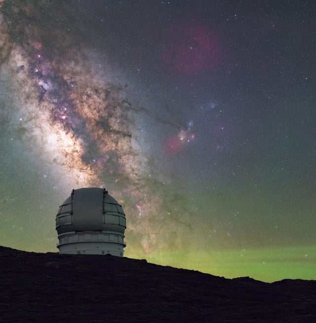 The Roque de los Muchachos Observatory, with its array of telescopes, sits perched atop La Palma under a breathtaking starry night sky.