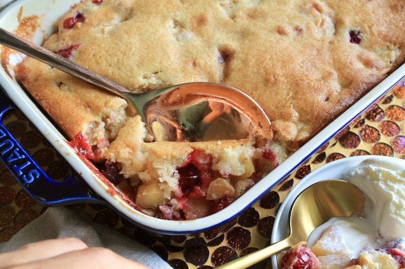 Step-by-step guide to making a rustic apple cranberry crumble in a cast iron skillet.