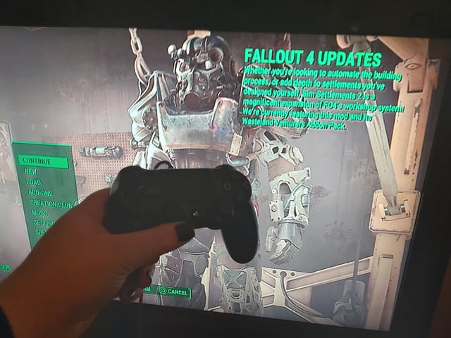 A fully developed Sim Settlements 2 city with complex buildings, skyscrapers, factories, advanced defenses, and bustling settler activity showcasing the mod's dynamic city-building mechanics.