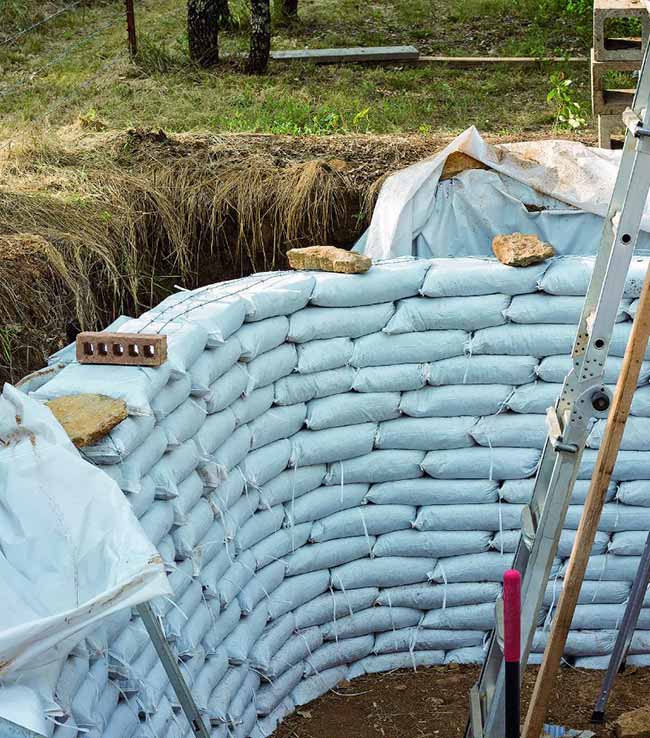 An earthbag root cellar, representing an alternative building method.