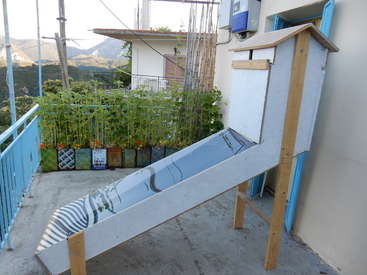 A makeshift solar dehydrator set up outside