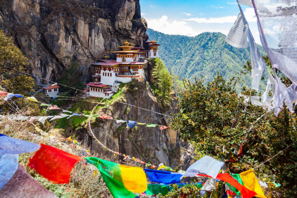 Guru Rinpoche Thongdrel unfurling, capturing the vibrant colors and intricate details of the religious artwork during the Paro Tshechu festival.