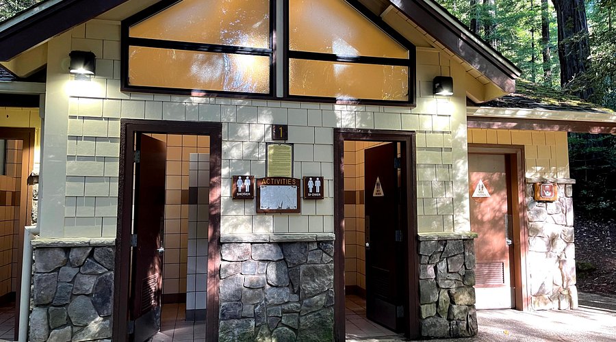 Close-up of the bathroom facilities at Whispering Pines Campground, showcasing clean toilets and sinks.