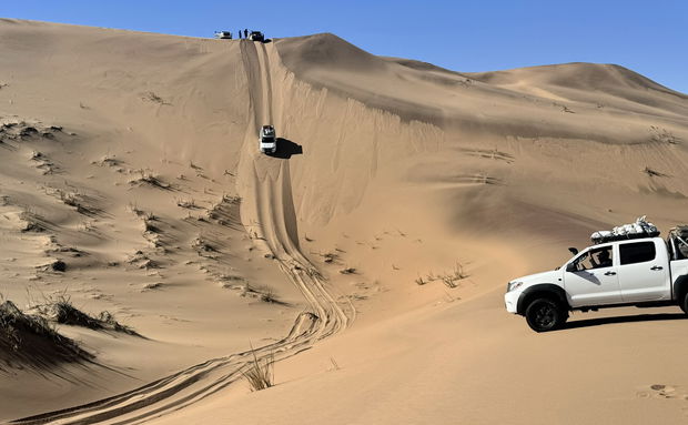 A shipwreck in the middle of a desert landscape