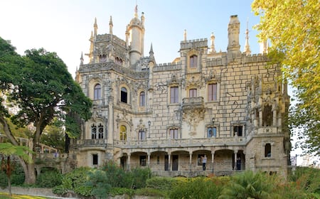 descriptive alt text: A view of the Initiation Well at Quinta da Regaleira, highlighting the mystical atmosphere and unique architectural features of the gardens.