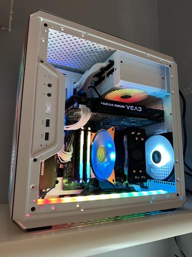 Flat-lay image of the Ryzen 5 5600G CPU, ASRock B450M Steel Legend motherboard, and Noctua NH-L9i cooler arranged on a dark gray surface. Use studio lighting to highlight the textures and details of the components. Add subtle dust motes for added realism. Ensure high resolution and sharpness.