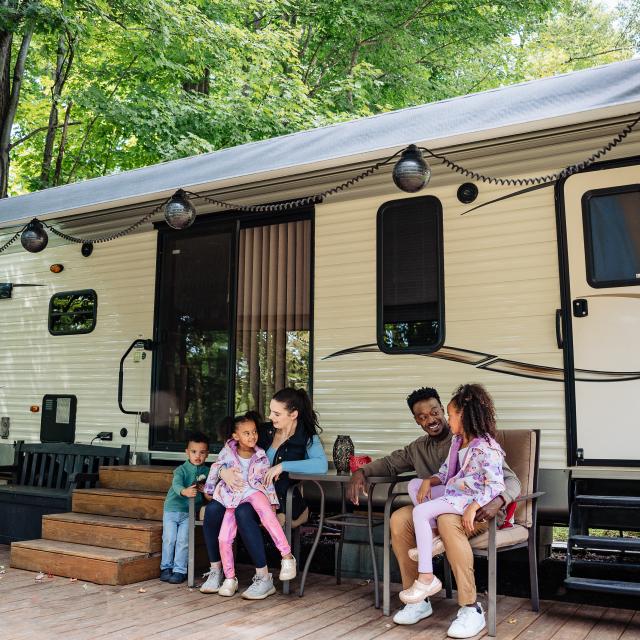 A family setting up their tent at Keen Lake Campground.