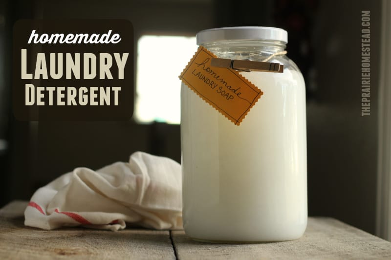 Close-up of homemade laundry detergent in a glass container with a wooden spoon