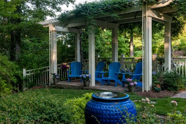 Family gathering around garden, using produce grown