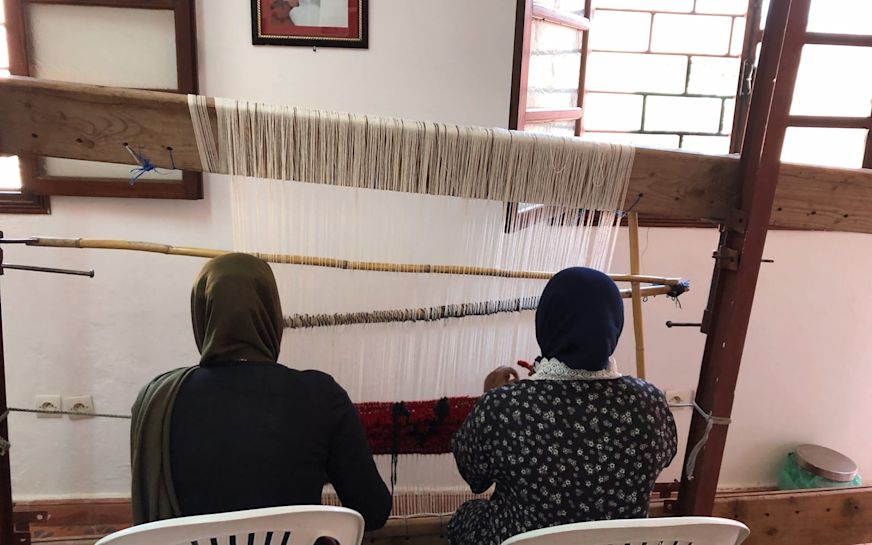 Berber women weaving at the Eve Branson Foundation