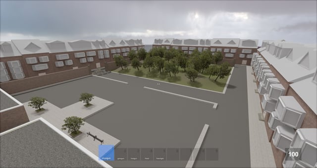 A group of developers gathered around a table, working collaboratively on a S&box project.