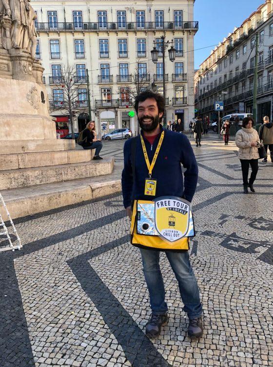 Backpacker struggling uphill in Lisbon