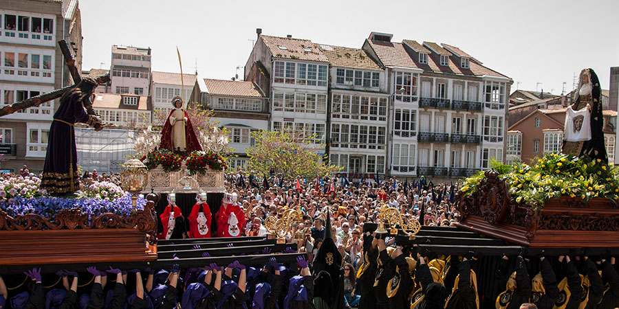 A Semana Santa procession moving through the streets of Seville