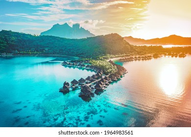 Overwater bungalows in Bora Bora at sunset