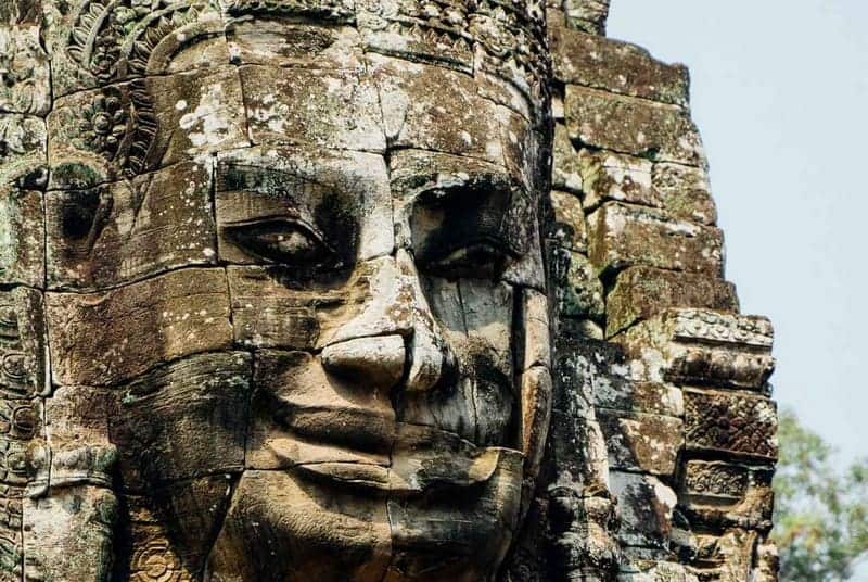 The Bayon Temple in Angkor Thom, showcasing the multitude of serene, smiling faces carved into the stone towers