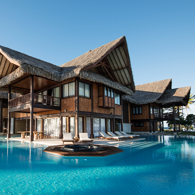 Images of the coral reef restoration projects, including divers working with Biorock structures and transplanted coral