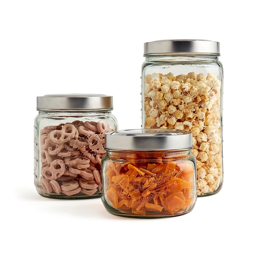 Mason jars filled with cleaning supplies on a white wooden table