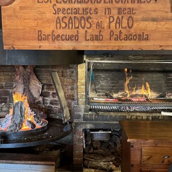 A panoramic view of the Torres del Paine mountains shrouded in mist and snow.