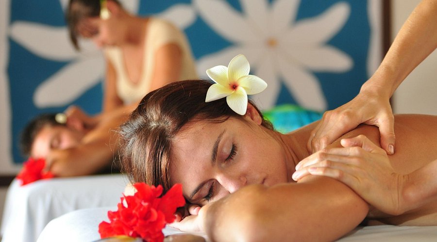 Candid shots of Liam and Chloe watching the fire dancers with expressions of awe and excitement.