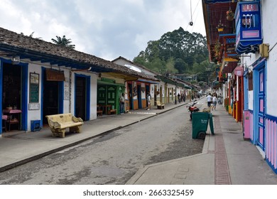 Marco speaking with Señora Isabella Rodriguez at Finca El Ocaso, discussing ethical coffee sourcing practices.