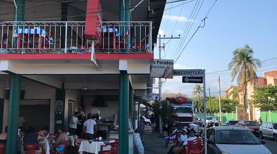 Interior of Taqueria Los Parados, showing the lively atmosphere.